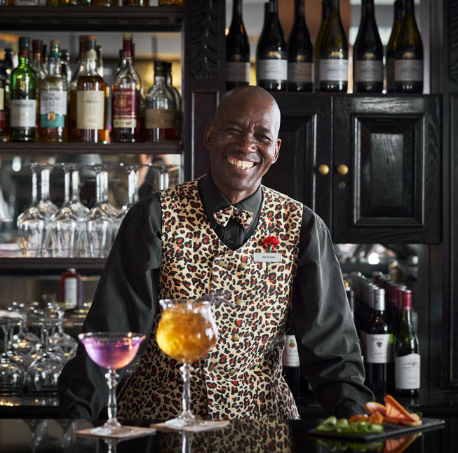 Barman serving cocktails